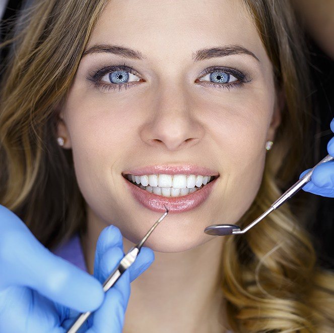 Woman receiving dental exam