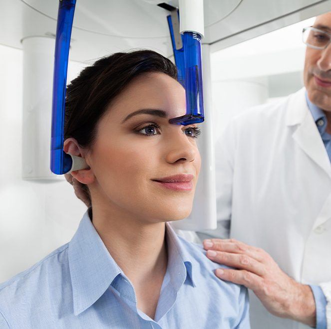 Woman receiving 3 D C T cone beam x-ray scan