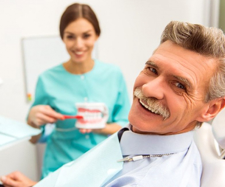 man at an appointment for dentures in Jacksonville