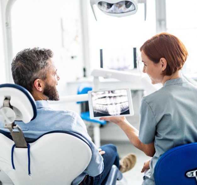 Man smiling at the dentist