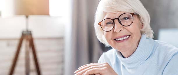 Woman smiling with dental implants in Jacksonville