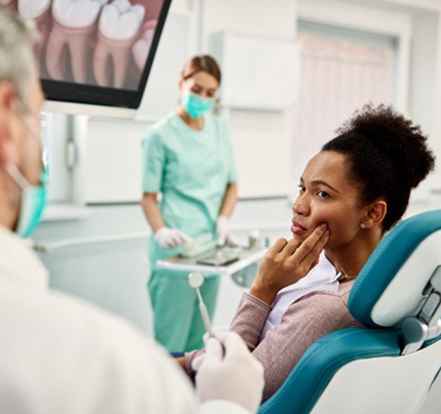 Woman at dental with tooth pain