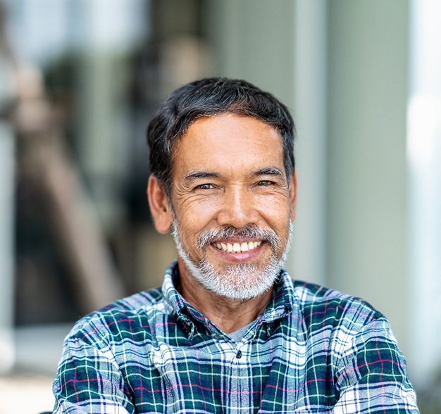 Man smiling with dental implants in Jacksonville