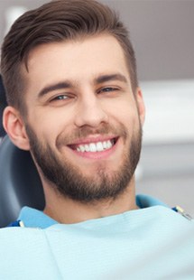 a man smiling after undergoing cosmetic dentistry near Mandarin