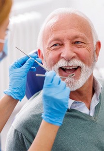 mature patient getting a dental checkup near Mandarin