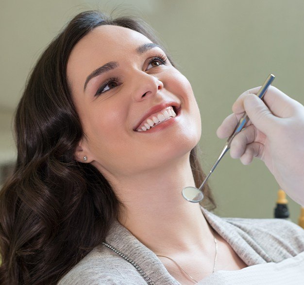 Woman receiving dental exam