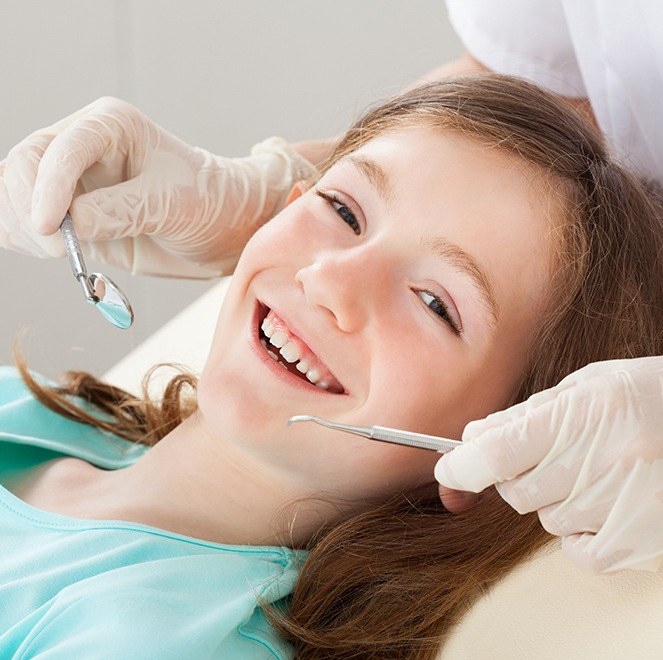 Child receiving dental checkup