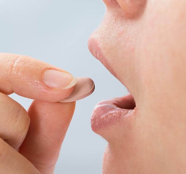 Patient taking oral conscious dental sedation pill